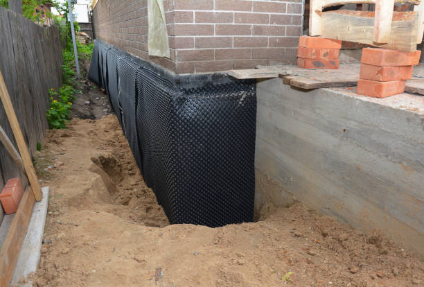 Happy homeowners after waterproofing job in Beaver Dam